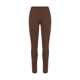 NikeSKIMS MATTE 26" LEGGING | DARK SEPIA FLAT ON A WHITE BACKGROUND | FLT