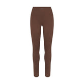 NikeSKIMS MATTE V-LINE 26" LEGGING | DARK SEPIA FLAT ON A WHITE BACKGROUND | FLT