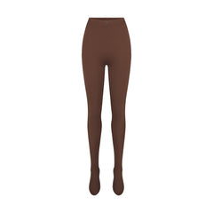 NikeSKIMS MATTE FOOTSIE GRIP LEGGING | DARK SEPIA FLAT ON A WHITE BACKGROUND | FLT