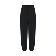 SKIMS SLEEP JOGGER | ONYX FLAT ON A WHITE BACKGROUND | FLT