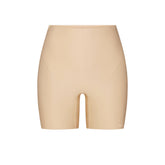 SKIMS BODY CORE SCULPT SHORTIE | SAND FLAT ON A WHITE BACKGROUND | FLT