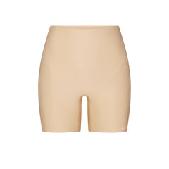 SKIMS BODY CORE SCULPT SHORTIE | SAND FLAT ON A WHITE BACKGROUND | FLT