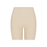 SKIMS BODY BUTT ENHANCING PADDED SHORT | SAND FLAT ON A WHITE BACKGROUND | FLT | FLT