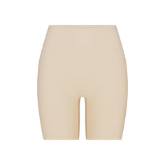 SKIMS BODY BUTT ENHANCING PADDED SHORT | SAND FLAT ON A WHITE BACKGROUND | FLT | FLT