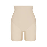 SKIMS BODY CORE SCULPT MID RISE SHORT | SAND FLAT ON A WHITE BACKGROUND | FLT | FLT