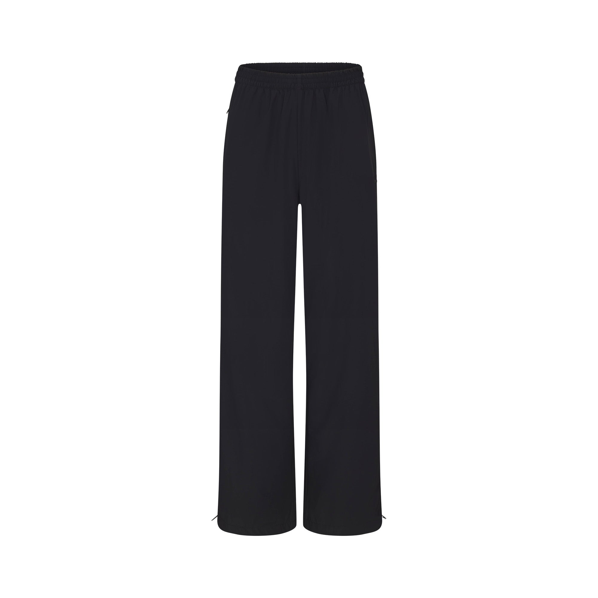 NikeSKIMS WOVEN NYLON OVERSIZED TRACK PANT | OBSIDIAN FLAT ON A WHITE BACKGROUND | FLT