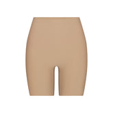 SKIMS BODY BUTT ENHANCING PADDED SHORT | CLAY FLAT ON A WHITE BACKGROUND | FLT | FLT