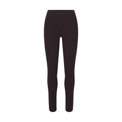 NikeSKIMS STUDIO STRETCH 26" LEGGING | DARK ROAST LAYS FLAT ON A WHITE BACKGROUND | FLT