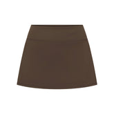 NikeSKIMS MATTE SKORT | NSKM DARK SEPIA LAYS FLAT ON A WHITE BACKGROUND | FLT