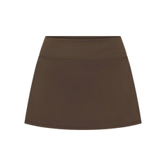 NikeSKIMS MATTE SKORT | NSKM DARK SEPIA LAYS FLAT ON A WHITE BACKGROUND | FLT