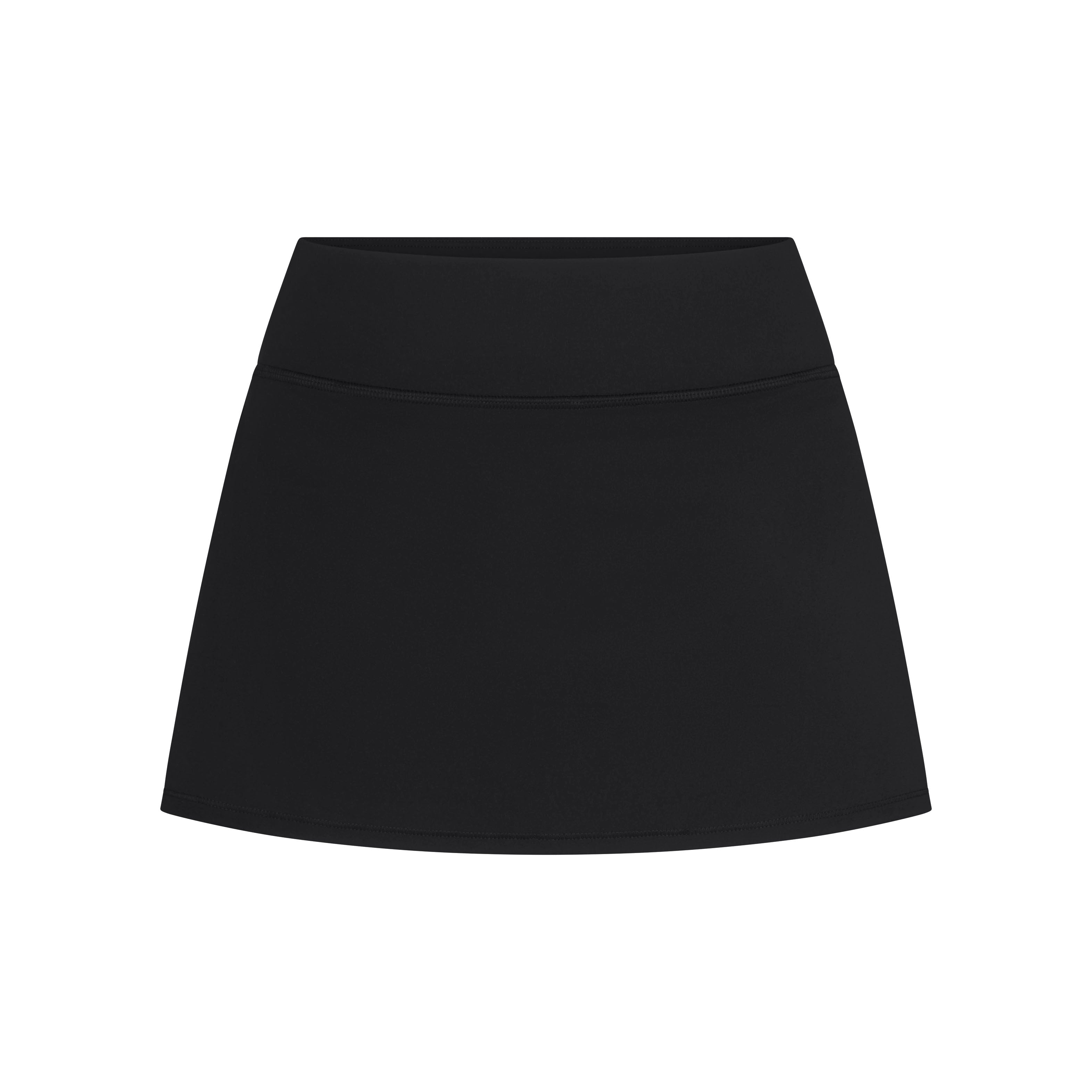 NikeSKIMS MATTE SKORT | NSKM OBSIDIAN LAYS FLAT ON A WHITE BACKGROUND | FLT
