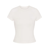 NikeSKIMS AIRY BABY TEE | IVORY LAYS FLAT ON A WHITE BACKGROUND | FLT