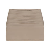 NikeSKIMS AIRY DRI-FIT™ FOLDOVER SKORT | DRIFTWOOD & LAYS FLAT ON A WHITE BACKGROUND | FLT