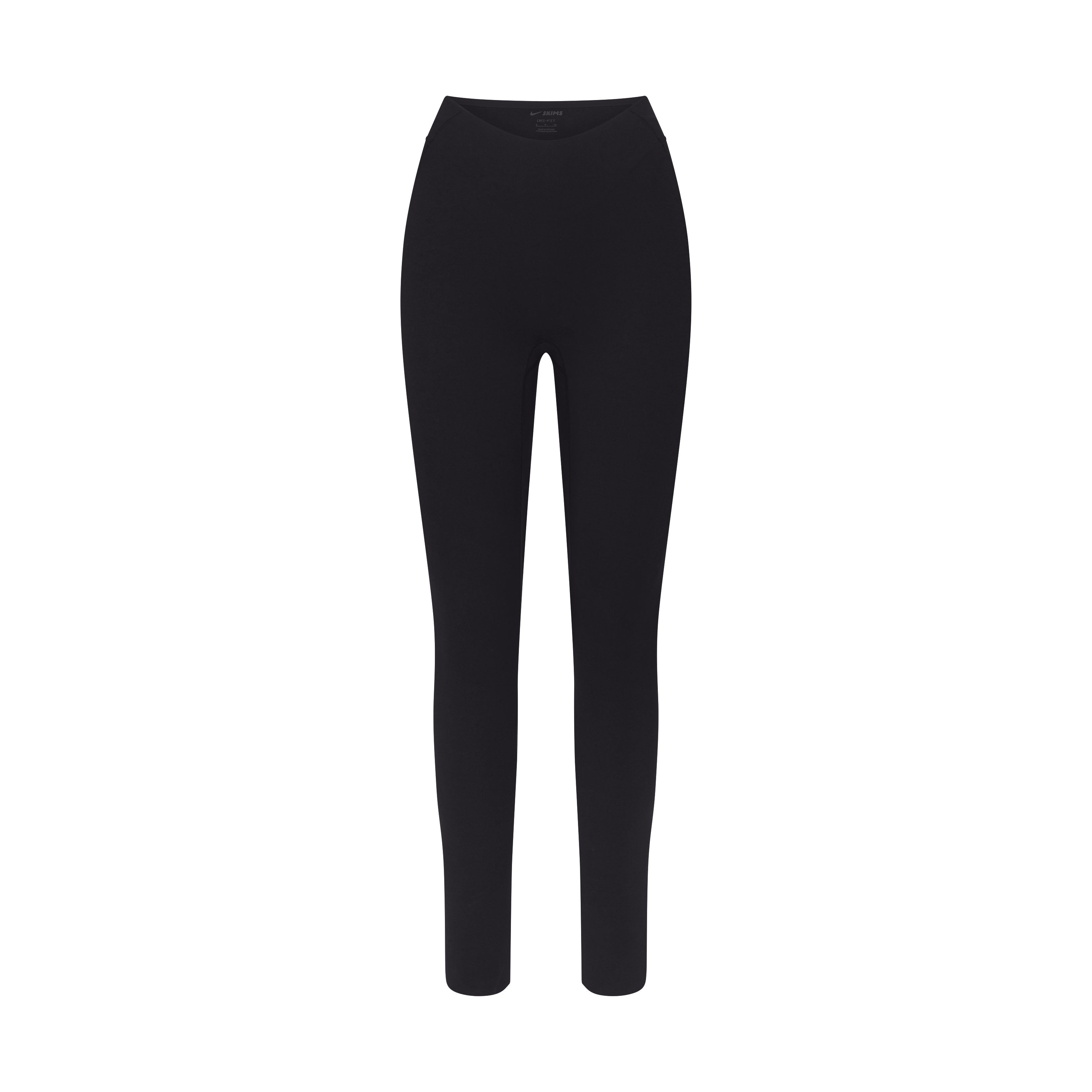 NikeSKIMS STUDIO STRETCH DIPPED 29" LEGGING | OBSIDIAN LAYS FLAT ON A WHITE BACKGROUND | FLT