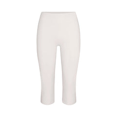 NikeSKIMS MATTE CROP 17" LEGGING | IVORY LAYS FLAT ON A WHITE BACKGROUND | FLT