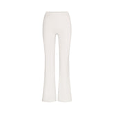 NikeSKIMS MATTE SLIM FLARE LEGGING | IVORY LAYS FLAT ON A WHITE BACKGROUND | FLT