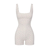 NikeSKIMS MATTE CORSET 2" ONE PIECE | DITSY FLORAL PRINT LAYS FLAT ON A WHITE BACKGROUND | FLT