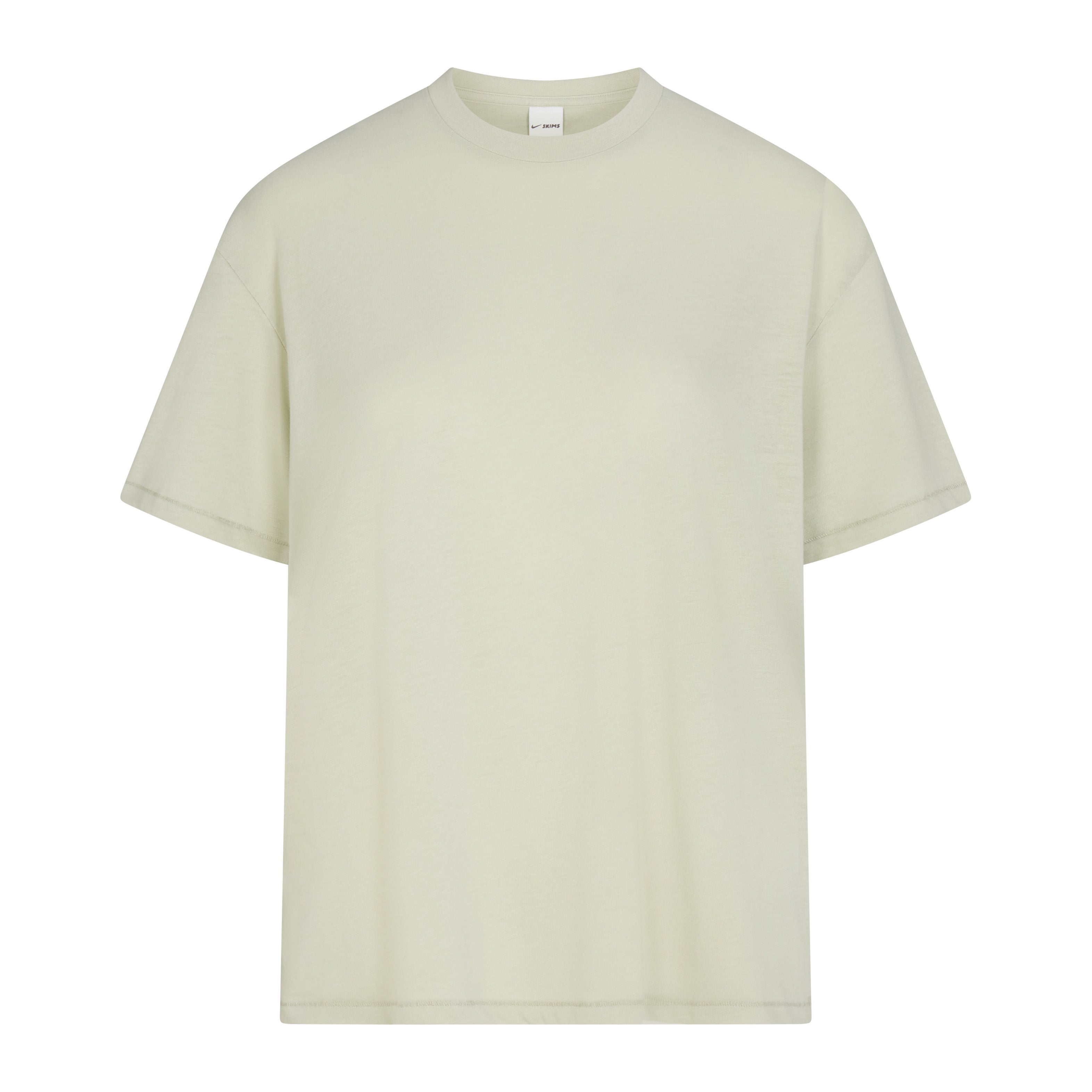 NikeSKIMS PERFORMANCE COTTON BLEND OVERSIZED SHORT SLEEVE TOP | TALC & LAYS FLAT ON A WHITE BACKGROUND | FLT