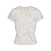 NikeSKIMS MATTE PADDED BABY TEE | DITSY FLORAL PRINT LAYS FLAT ON A WHITE BACKGROUND | FLT