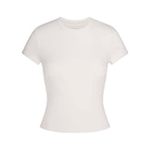 NikeSKIMS MATTE PADDED BABY TEE | IVORY LAYS FLAT ON A WHITE BACKGROUND | FLT