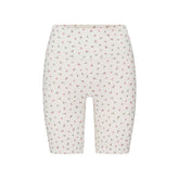 NikeSKIMS MATTE 5" BIKER SHORT | DITSY FLORAL PRINT LAYS FLAT ON A WHITE BACKGROUND | FLT