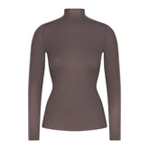 NikeSKIMS WEIGHTLESS LAYERS MOCK NECK LONG SLEEVE TOP | BOULDER & LAYS FLAT ON A WHITE BACKGROUND | FLT