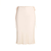 SKIMS ROMANCE MIDI SKIRT | PRIMROSE FLAT ON A WHITE BACKGROUND | FLT