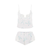 SKIMS ROMANCE CAMI AND SHORT SET | IVORY PEARL BOWS PRINT FLAT ON A WHITE BACKGROUND | FLT