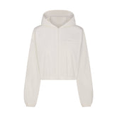 WOVEN COTTON CROPPED ZIP UP JACKET | EGRET FLAT ON A WHITE BACKGROUND | FLT