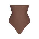SKIMS BODY CORE SCULPT HIGH-WAISTED THONG | JASPER FLAT ON A WHITE BACKGROUND | FLT | FLT