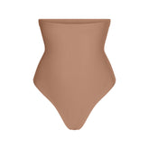 SKIMS BODY CORE SCULPT HIGH-WAISTED THONG | SIENNA FLAT ON A WHITE BACKGROUND | FLT | FLT