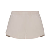 NikeSKIMS WOVEN NYLON 2.5" RUNNER SHORT | STONE FLAT ON A WHITE BACKGROUND | FLT