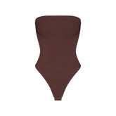 SMOOTH LAYERS STRAPLESS BODYSUIT | COCOA FLAT ON A WHITE BACKGROUND | FLT