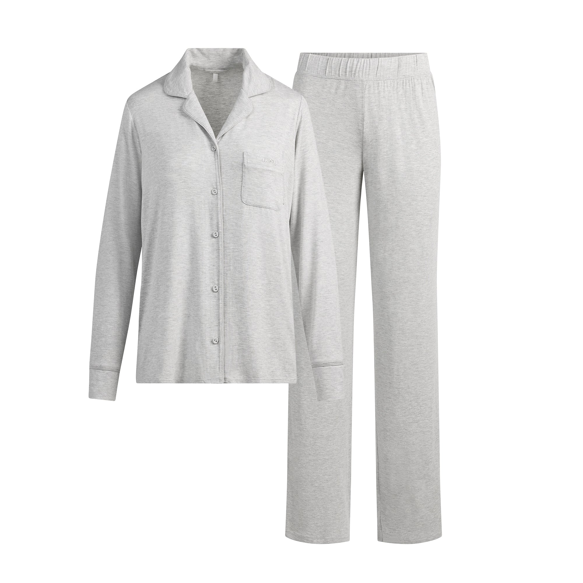 SKIMS SLEEP LONG SLEEVE BUTTON UP SET | LIGHT HEATHER GREY (LONG SLEEVE T-SHIRTS, BOTTOMS) LAYS FLAT ON A WHITE BACKGROUND | FLT
