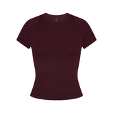 NikeSKIMS AIRY BABY TEE | CURRANT FLAT ON A WHITE BACKGROUND | FLT