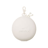 NikeSKIMS ACCESSORIES HARDSHELL ROUND CASE | IVORY LAYS FLAT ON A WHITE BACKGROUND