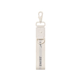 NikeSKIMS ACCESSORIES KEYCHAIN WRISTLET | IVORY LAYS FLAT ON A WHITE BACKGROUND