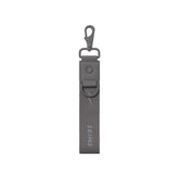NikeSKIMS ACCESSORIES KEYCHAIN WRISTLET | ARMOR LAYS FLAT ON A WHITE BACKGROUND