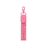 NikeSKIMS ACCESSORIES KEYCHAIN WRISTLET | LIGHT FLAMINGO LAYS FLAT ON A WHITE BACKGROUND