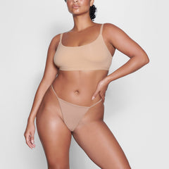 ON A MODEL FRONT VIEW FITS EVERYBODY T STRING THONG IN OCHRE