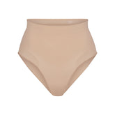 SEAMLESS SCULPT MID WAIST BRIEF | MICA (SHAPEWEAR BRIEFS, PANTIES) LAYS FLAT ON A WHITE BACKGROUND | FLT