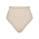 SEAMLESS SCULPT MID WAIST BRIEF | SAND (SHAPEWEAR BRIEFS, PANTIES) LAYS FLAT ON A WHITE BACKGROUND | FLT