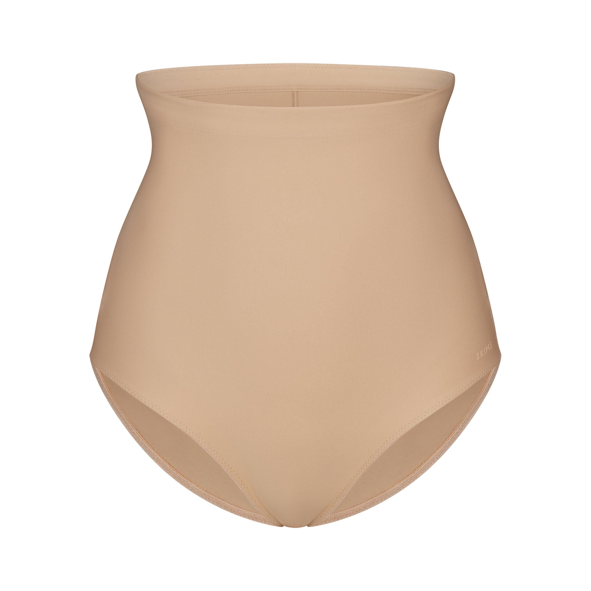 SKIMS BODY CORE SCULPT BUTT LIFTING BRIEF | CLAY FLAT ON A WHITE BACKGROUND | FLT