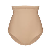 SKIMS BODY CORE SCULPT BUTT LIFTING BRIEF | CLAY FLAT ON A WHITE BACKGROUND | FLT
