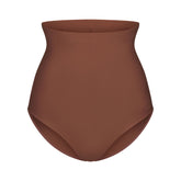 SKIMS BODY CORE SCULPT BUTT LIFTING BRIEF | JASPER FLAT ON A WHITE BACKGROUND | FLT