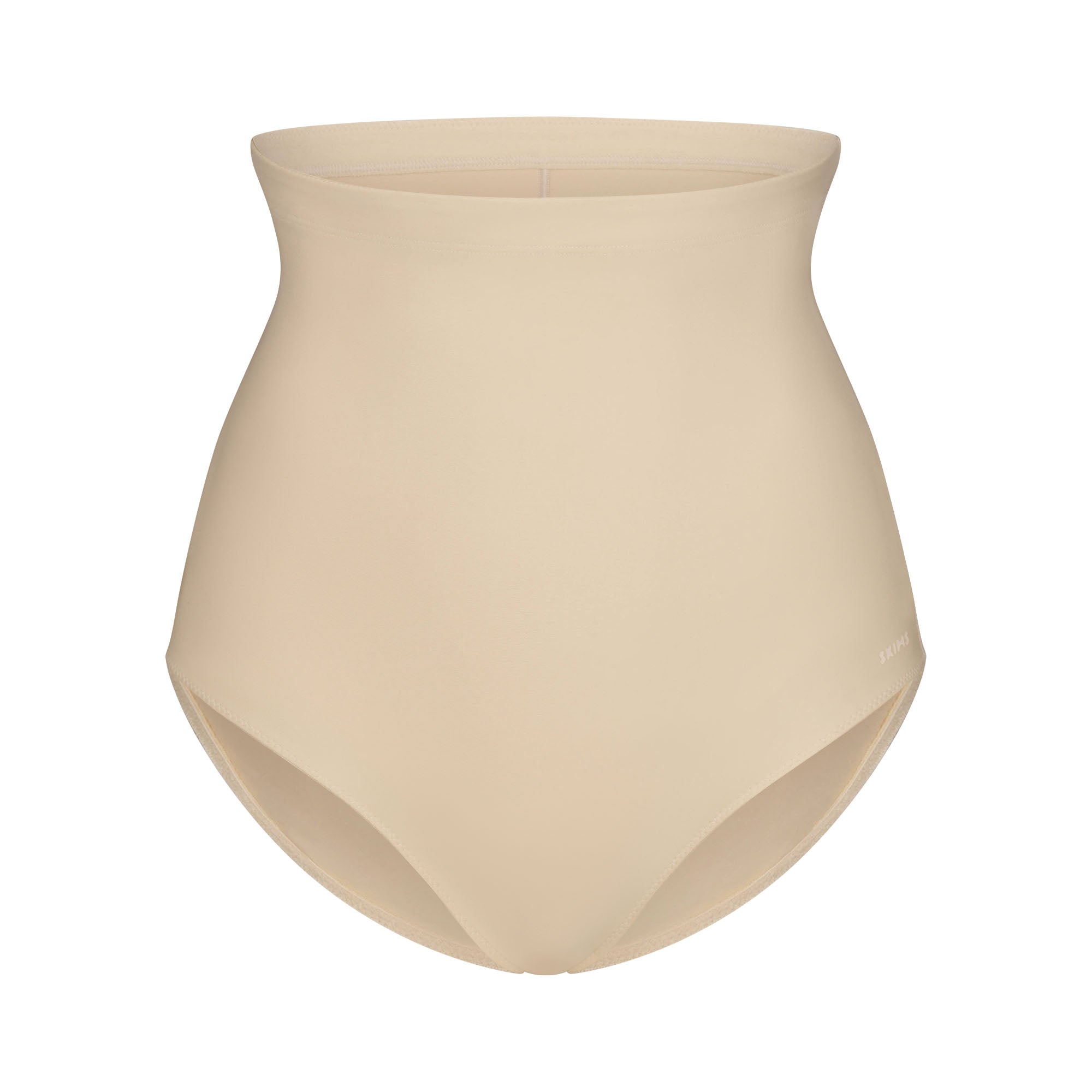 SKIMS BODY CORE SCULPT BUTT LIFTING BRIEF | SAND FLAT ON A WHITE BACKGROUND | FLT