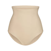 SKIMS BODY CORE SCULPT BUTT LIFTING BRIEF | SAND FLAT ON A WHITE BACKGROUND | FLT