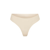 NAKED DIPPED THONG | SAND (THONGS, PANTIES) LAYS FLAT ON A WHITE BACKGROUND | FLT