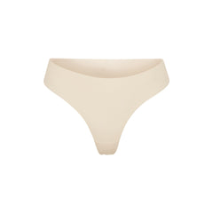NAKED DIPPED THONG | SAND (THONGS, PANTIES) LAYS FLAT ON A WHITE BACKGROUND | FLT