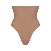 SEAMLESS SCULPT HIGH-WAISTED THONG | SIENNA (SHAPEWEAR THONGS, SHAPEWEAR) LAYS FLAT ON A WHITE BACKGROUND | FLT